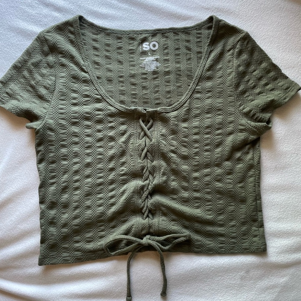 SO Crisscross lace-up Textured Crop Top with strings tied in a bow at bottom
